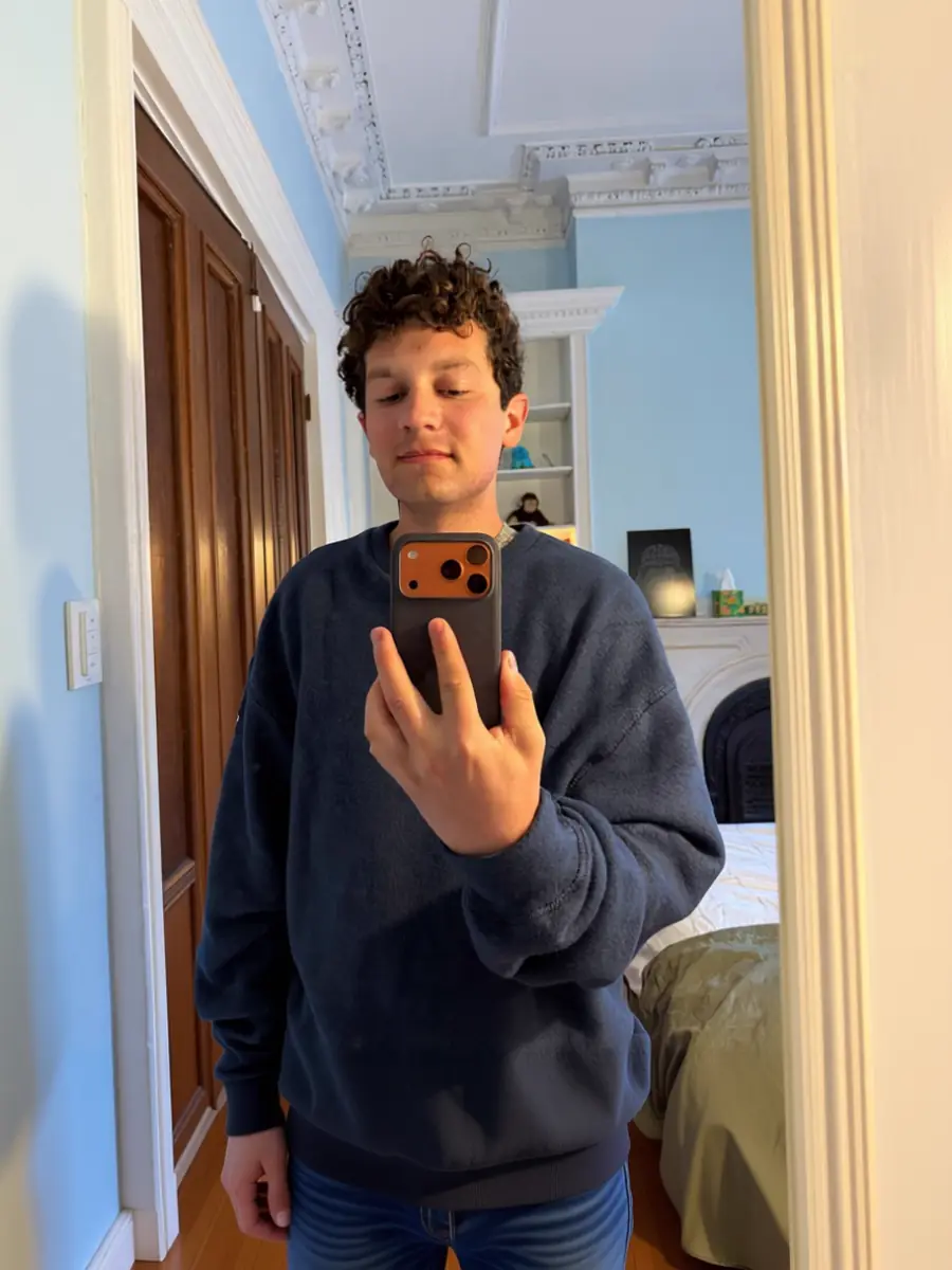 Before: Before and after AI coffee shop dating photo transformation — typical selfie to warm window-lit portrait.